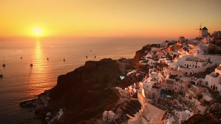 Traveler enjoying a sunset view in Santorini, Greece