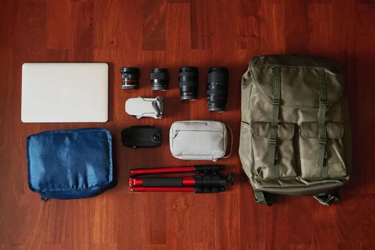 Traveler's backpack with a passport, map, and camera inside
