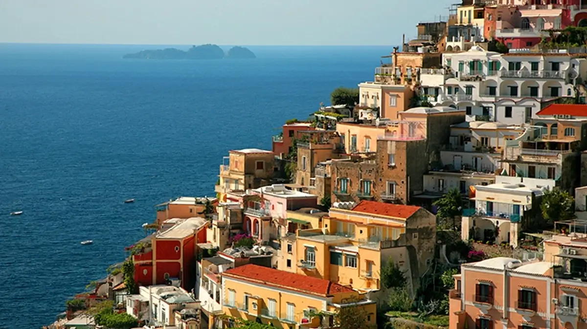 Colorful houses perched on cliffs along the Amalfi Coast in Italy