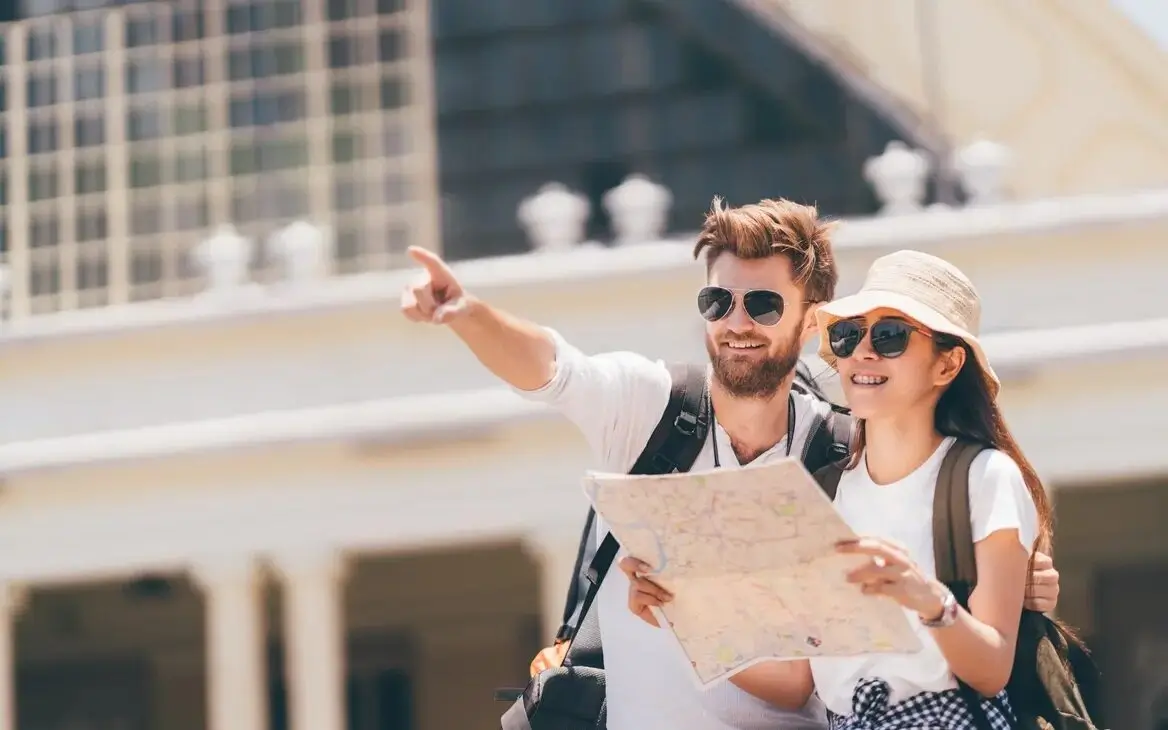 A local guide smiling and interacting with travelers