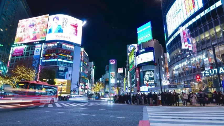 Shibuya Crossing in Tokyo, Japan, at night with neon lights